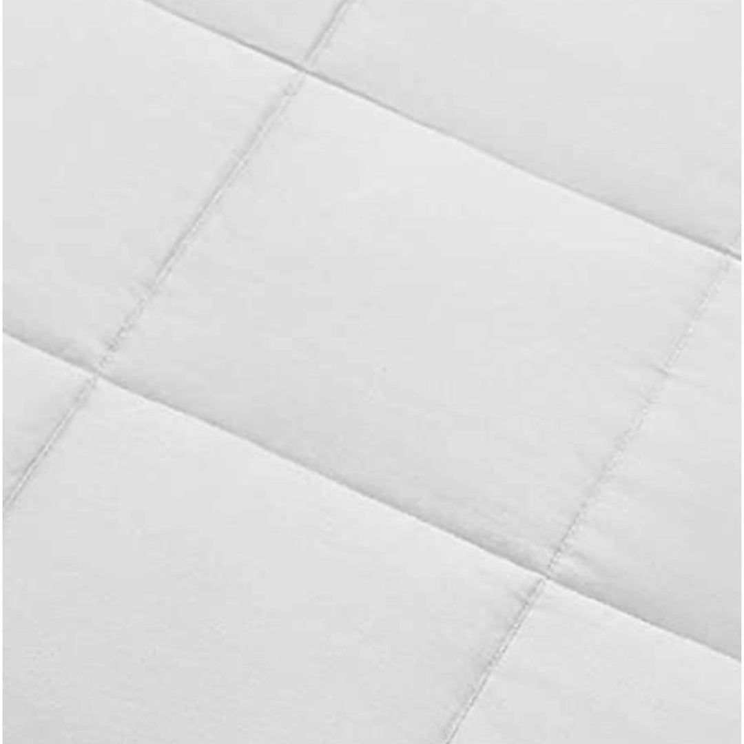 Close-up of  bamboo comforter fabric showing soft twill weave and smooth, breathable texture under natural light