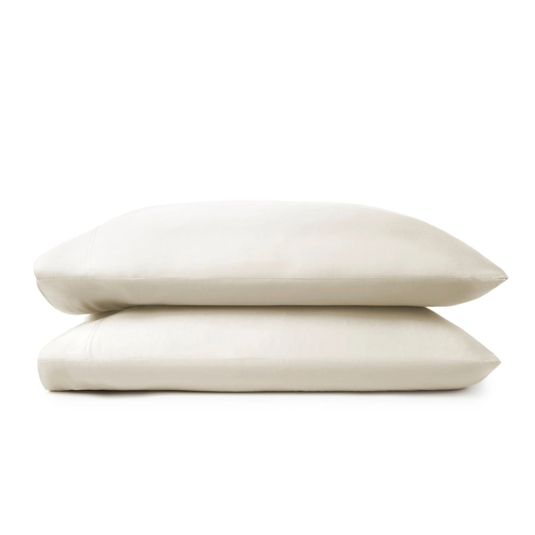 Cream bamboo pillowcases from the Premium Collection, clean stacked display on white background with stitching detail visible