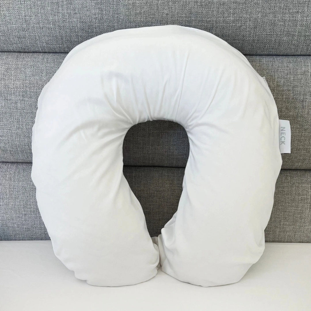 White cooling bamboo neck pillowcase designed for travel comfort, featuring breathable, temperature-regulating fabric
