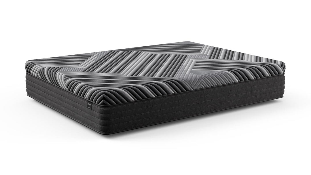 Angled view of the Copper Calm Hybrid mattress by Bamboo is Better, showing its gray and black geometric design and plush hybrid construction on a white background.