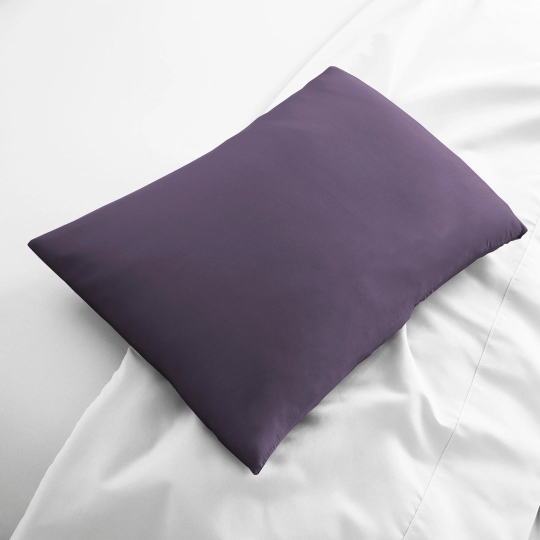 royal purple bamboo lumbar pillowcase from the Signature Collection, displayed flat on white bedding with sateen finish and soft texture