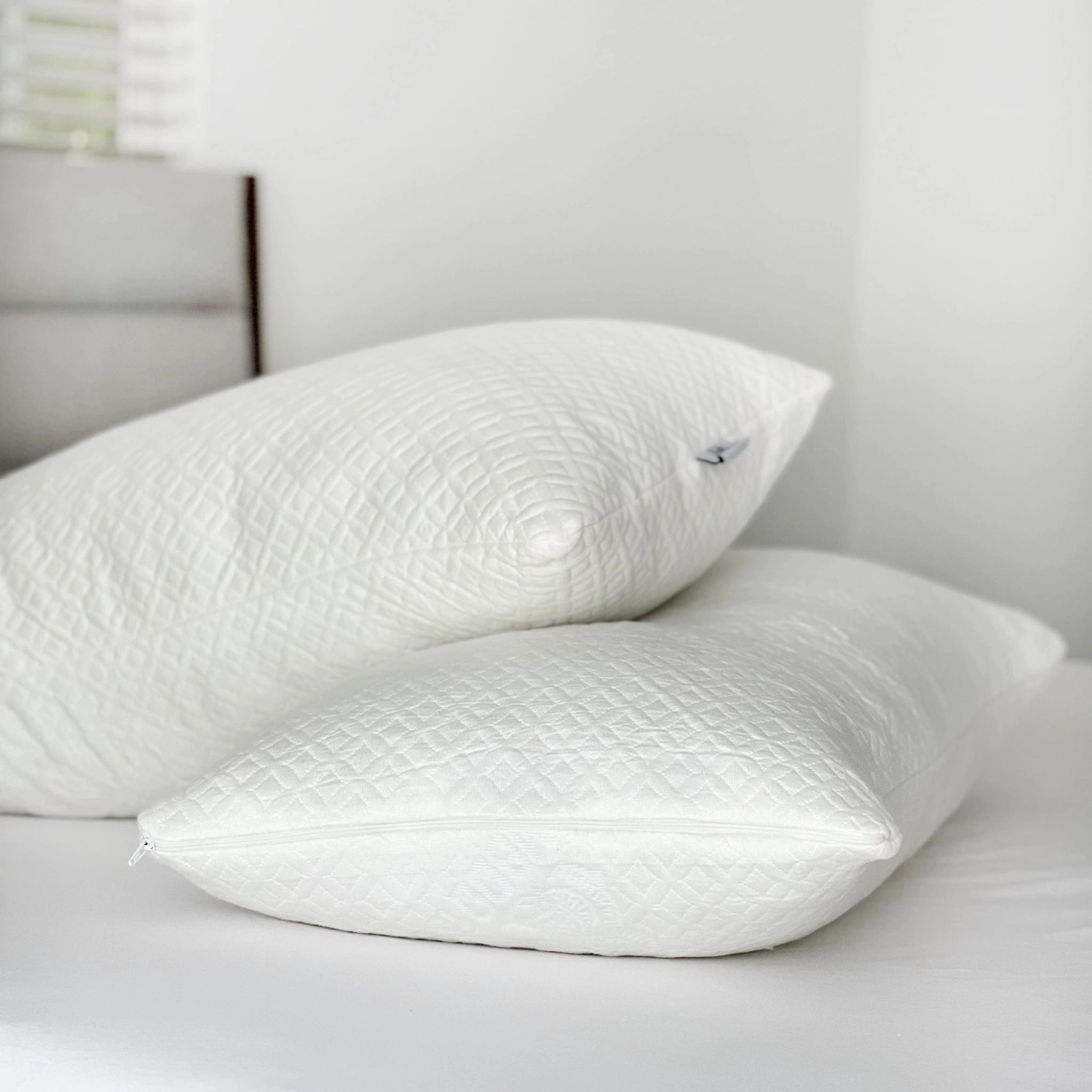 Stacked sustainable bamboo pillows showcasing soft, breathable fabric and eco-conscious design for comfortable, green sleep solutions