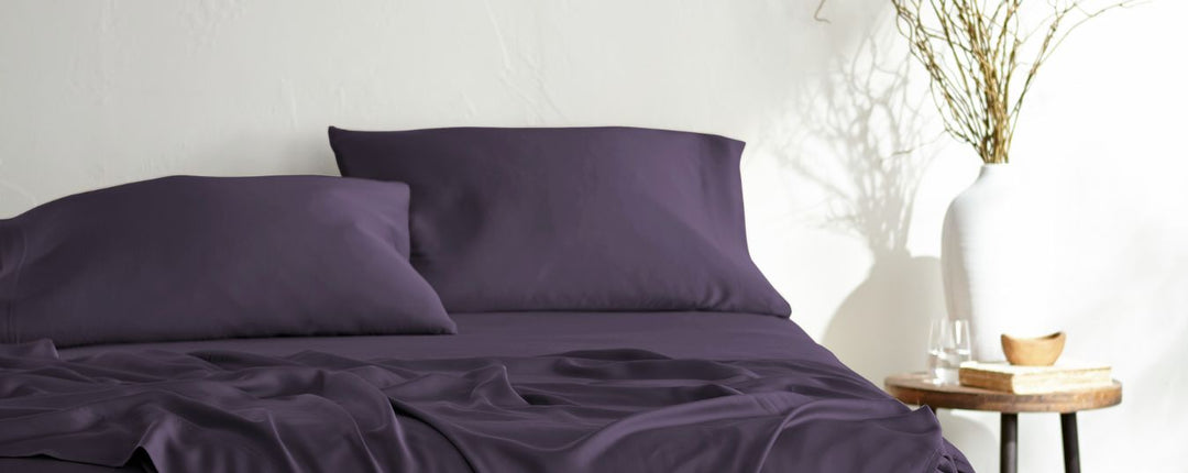 Bamboo viscose sheets on a made bed, illustrating skin-friendly benefits of bamboo bedding.