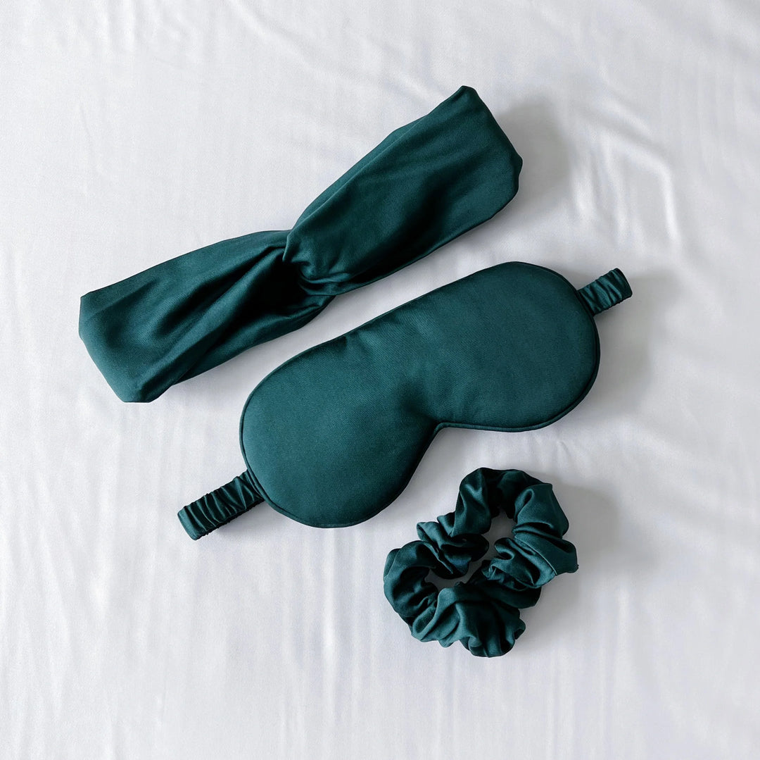 Cooling bamboo self-care accessories set in emerald green — sleep mask, eye mask and spa essentials