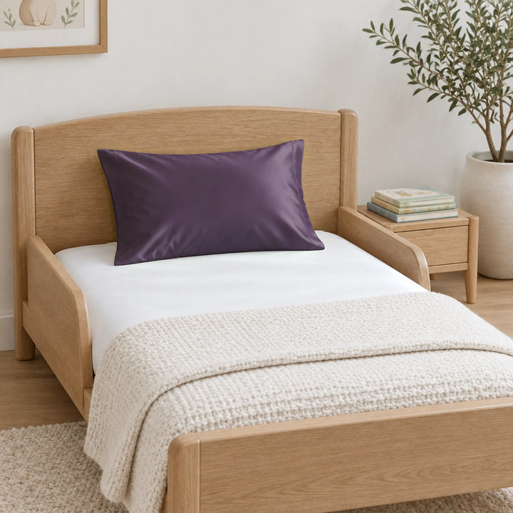 Royal purple cooling bamboo viscose toddler pillowcase on a light-oak toddler bed