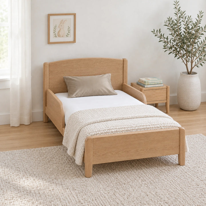 Taupe cooling bamboo viscose toddler pillowcase on a toddler bed in a calm, light nursery