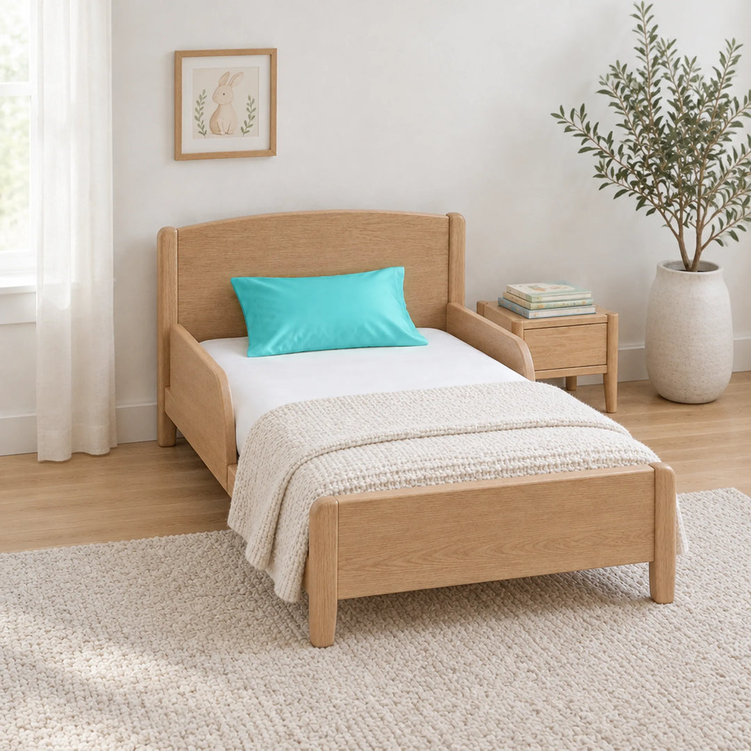 Tiffany blue cooling bamboo viscose toddler pillowcase on a toddler bed in a calm, light nursery