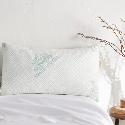 Single bamboo pillow placed on a made bed