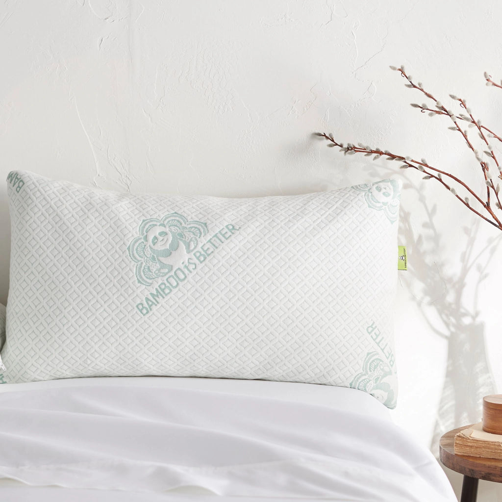 Single bamboo pillow placed on a made bed