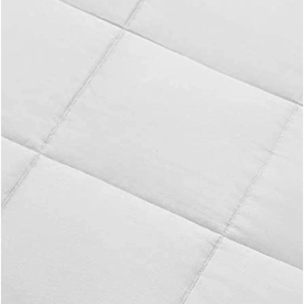 Close-up of  bamboo comforter fabric showing soft twill weave and smooth, breathable texture under natural light