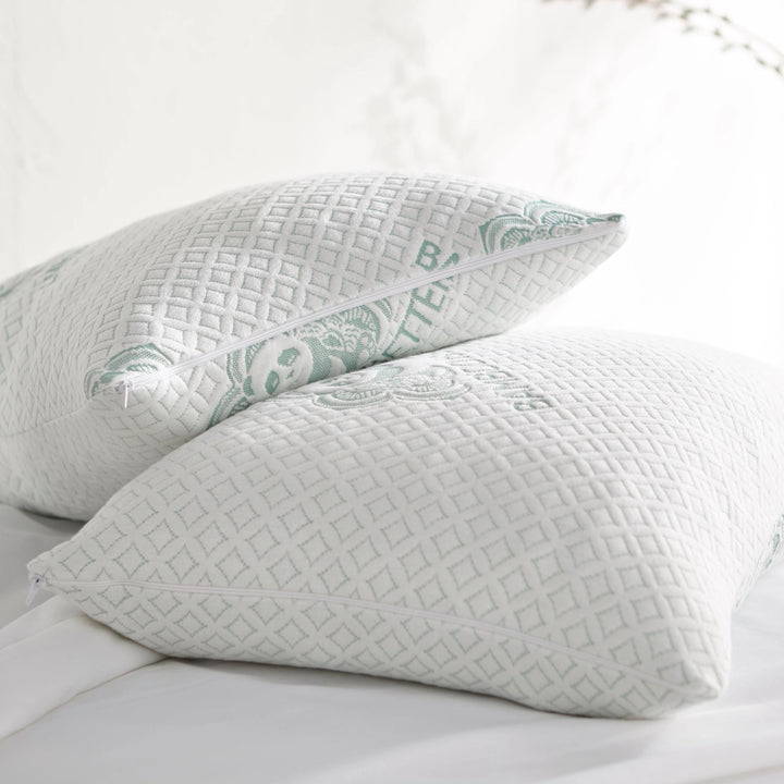 Set of two queen-size bamboo pillows on a stylish bed