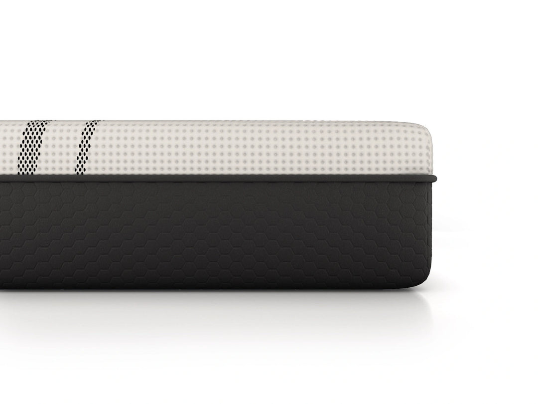 Detailed close-up of graphite-infused hybrid mattress showcasing cooling fabric and advanced construction