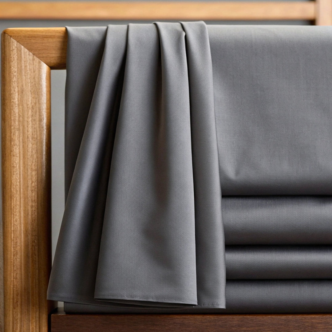 Graphite gray copper-infused bamboo viscose fabric, close-up of the smooth sateen weave — the same 330 thread count fabric used in the Copper Body Pillowcase.