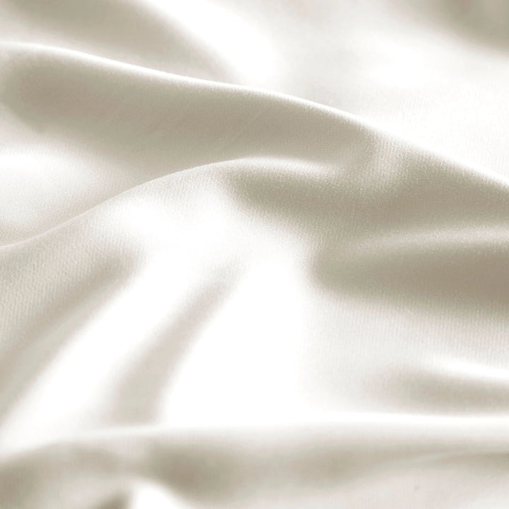close-up of Cream bamboo bed sheets with sateen weave from the Premium Collection, highlighting silky texture and smooth drape