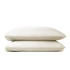 Cream bamboo pillowcases from the Premium Collection, clean stacked display on white background with stitching detail visible