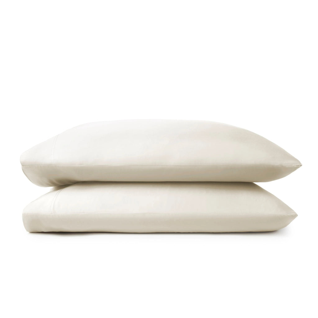 Cream bamboo pillowcases from the Premium Collection, clean stacked display on white background with stitching detail visible