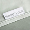 sage bamboo bed sheets with clearly labeled 'head' and 'foot' tags for easy bed-making