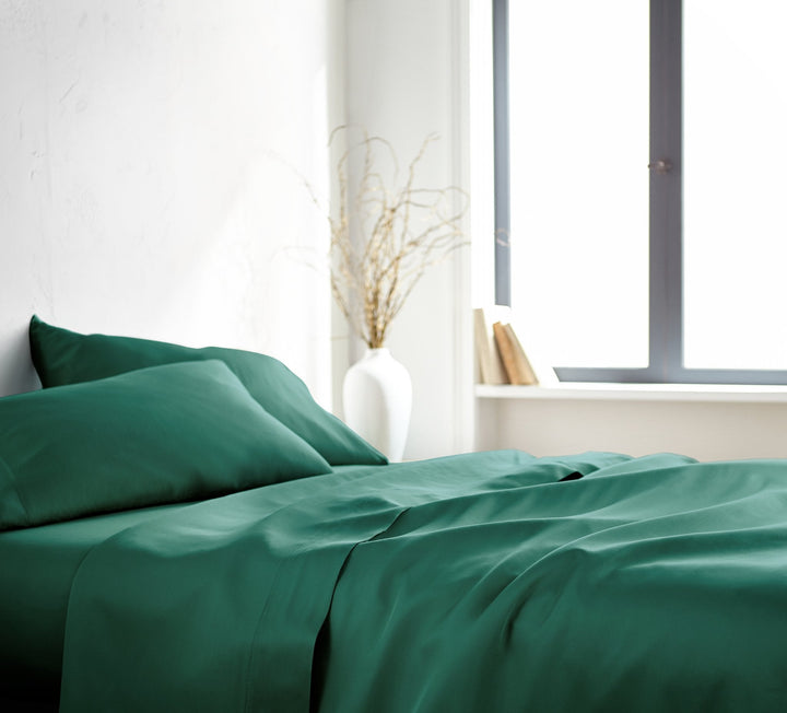 emerald green bamboo bed sheets from the Signature Collection, side view — the same sheets supplied in Split Cal King