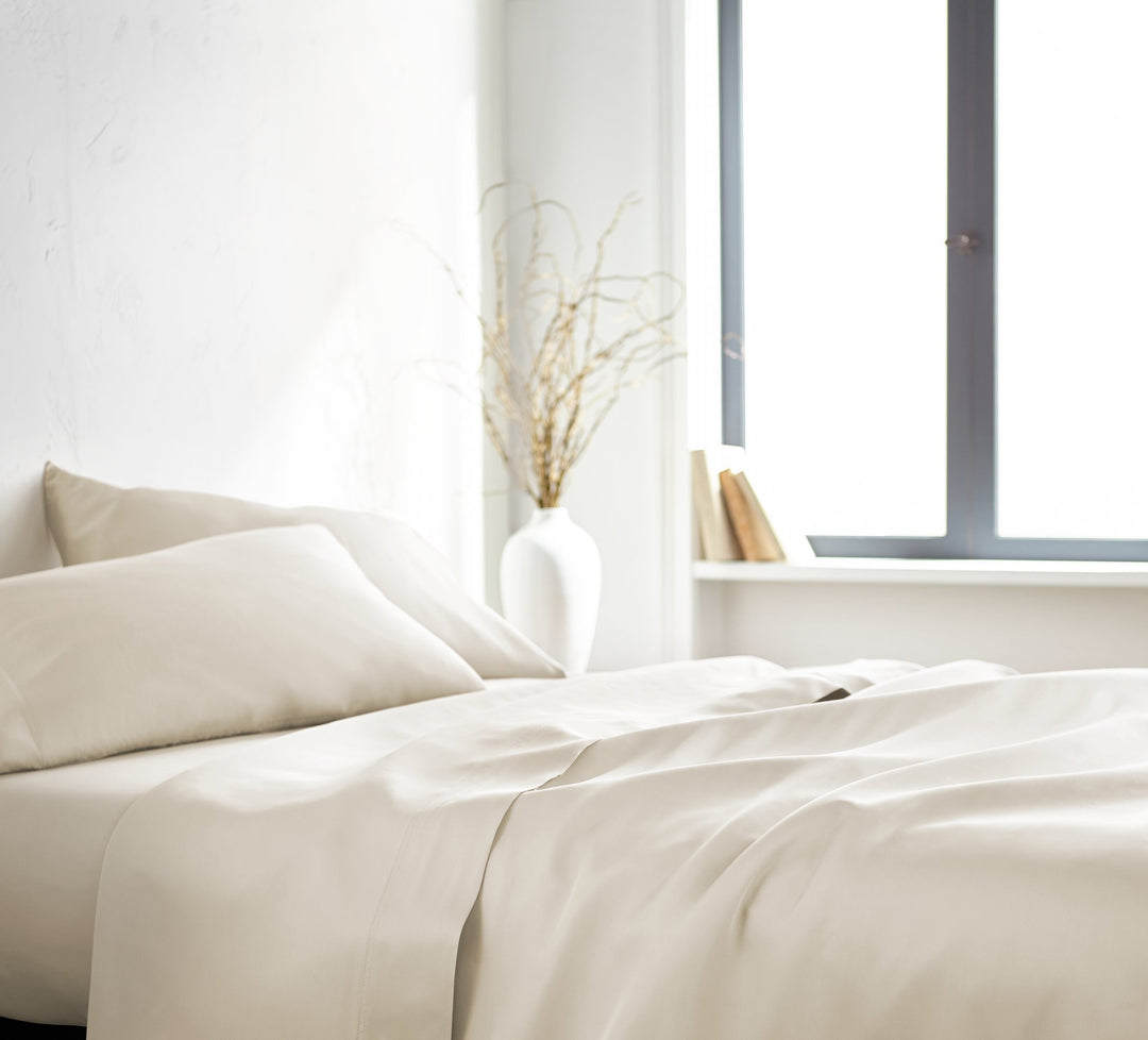 Ivory Signature Flat Sheet — silky sateen drape, side view