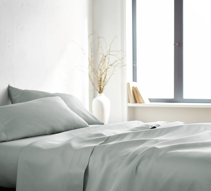 Silver Signature Flat Sheet — silky sateen drape, side view