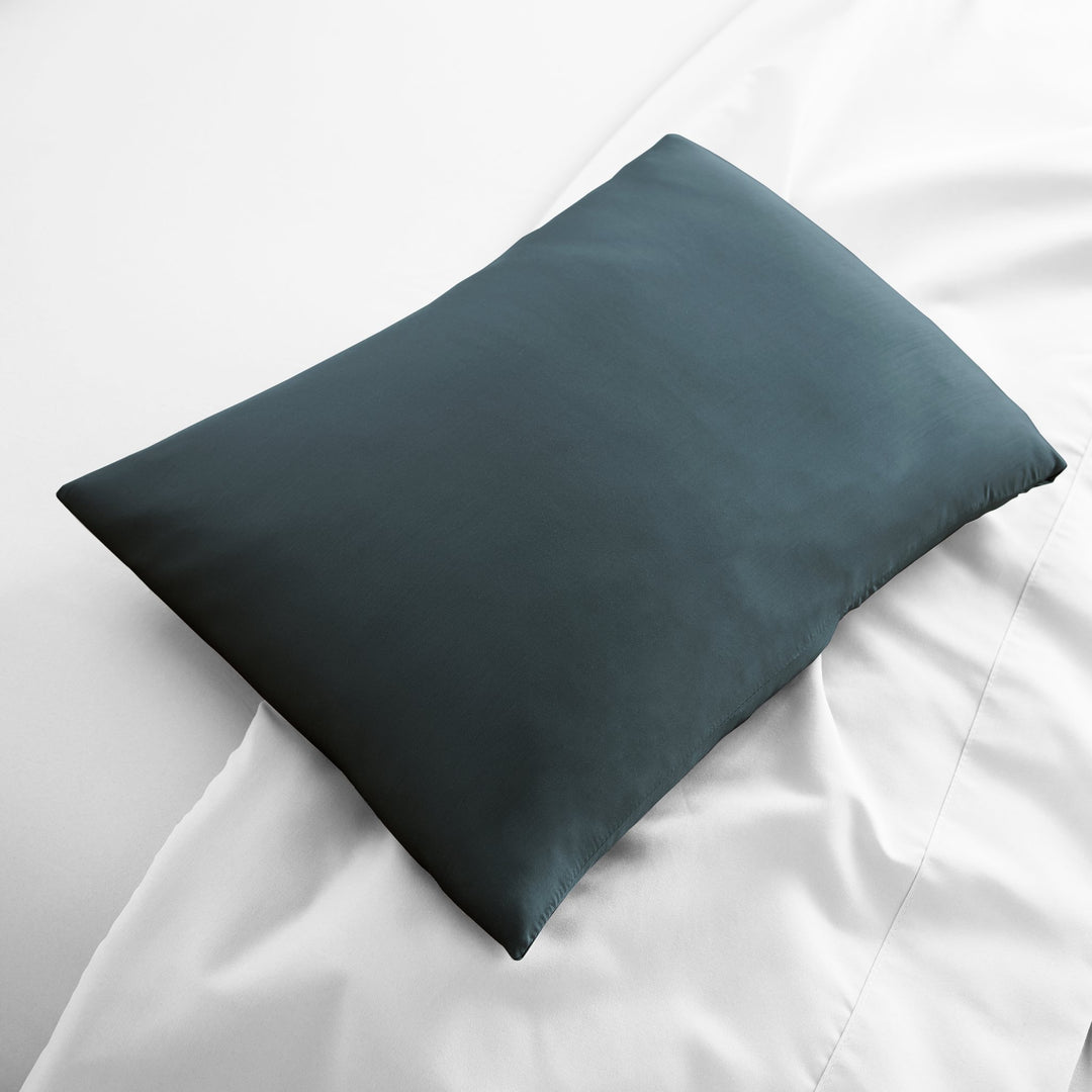slate bamboo lumbar pillowcase from the Signature Collection, displayed flat on white bedding with sateen finish and soft texture