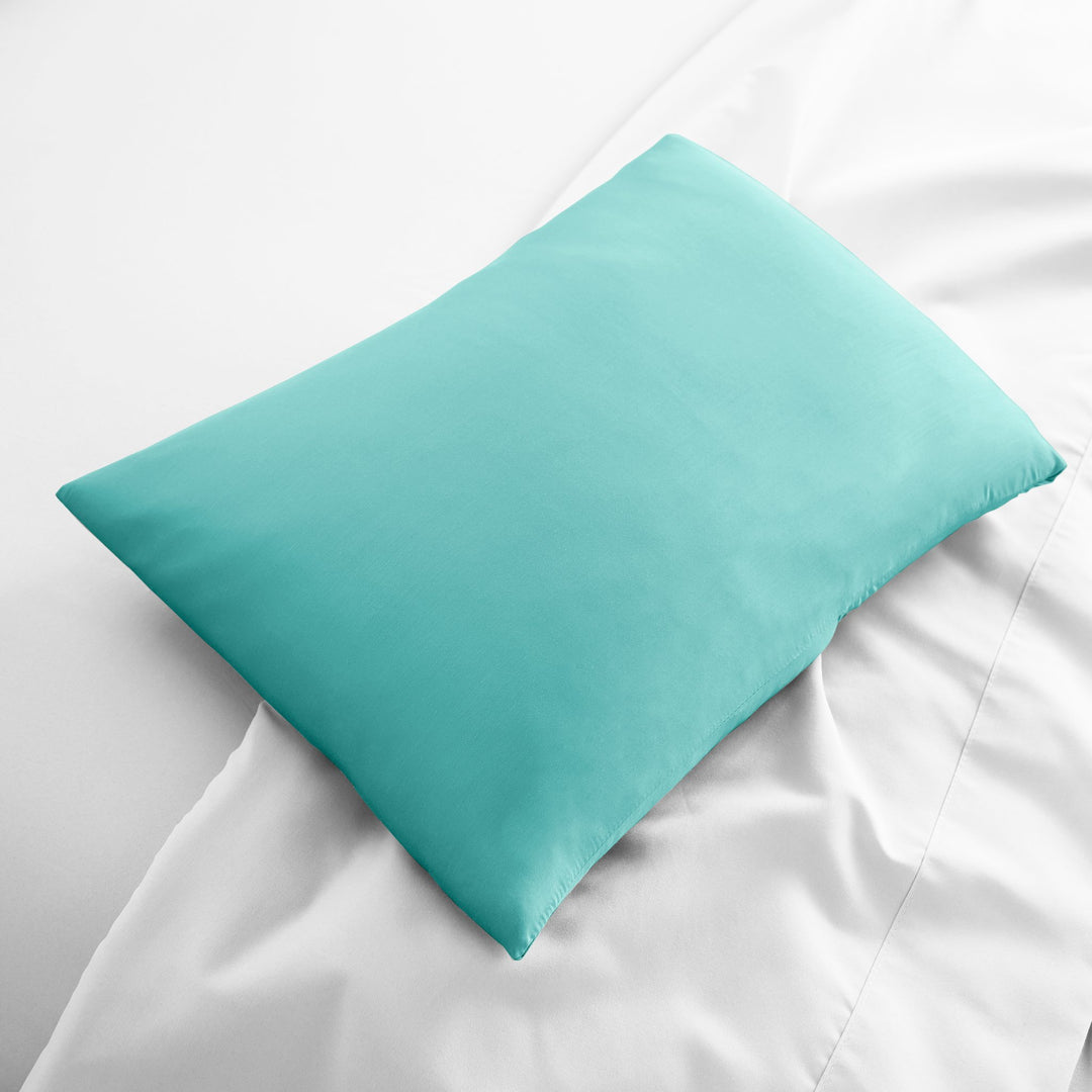 tiffany blue bamboo lumbar pillowcase from the Signature Collection, displayed flat on white bedding with sateen finish and soft texture