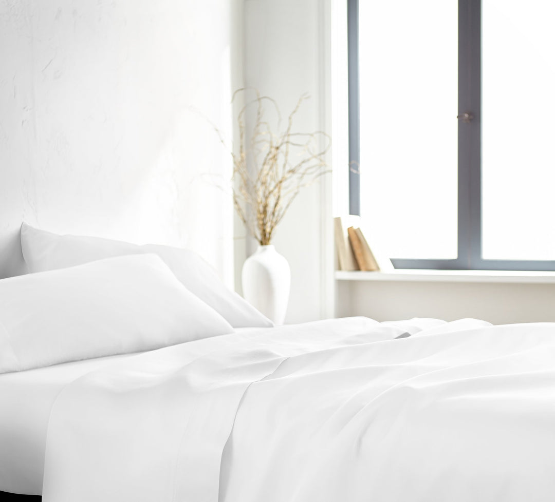 White Signature Flat Sheet — silky sateen drape, side view