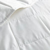 Close-up of the bamboo comforter’s stitching, designed to prevent filling from clumping or shifting, ensuring even warmth and lasting comfort.