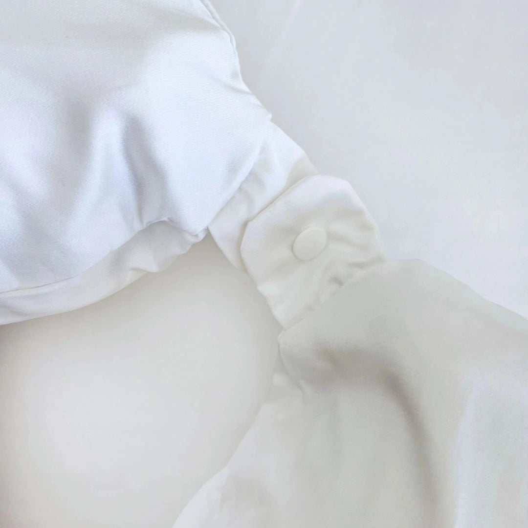 White bamboo neck pillowcase featuring a soft fabric tie closure, designed for breathable comfort and secure travel use