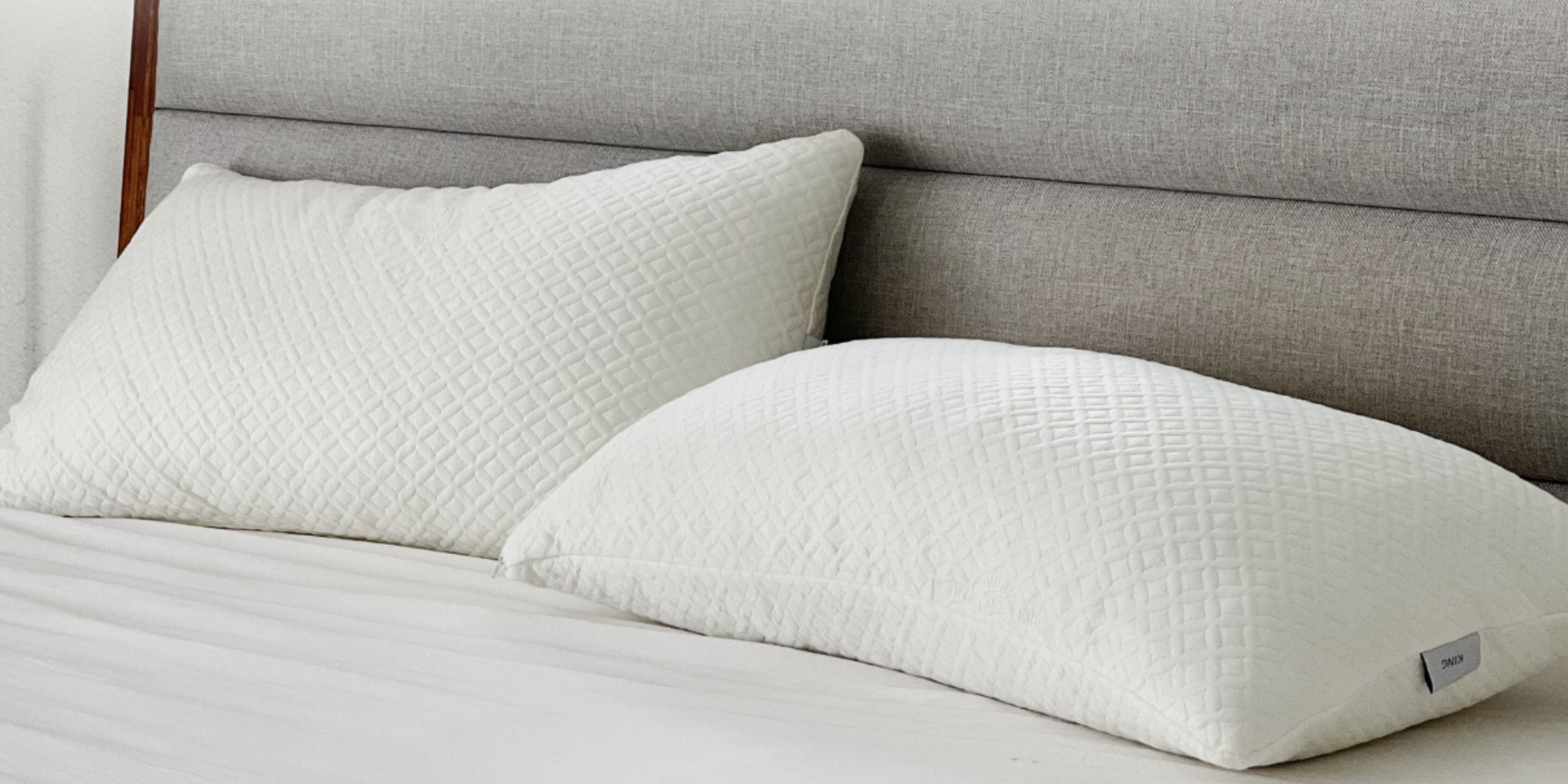 Close-up of bamboo pillows on a bed with a soft quilted design, offering a cozy and comfortable sleep environment.





