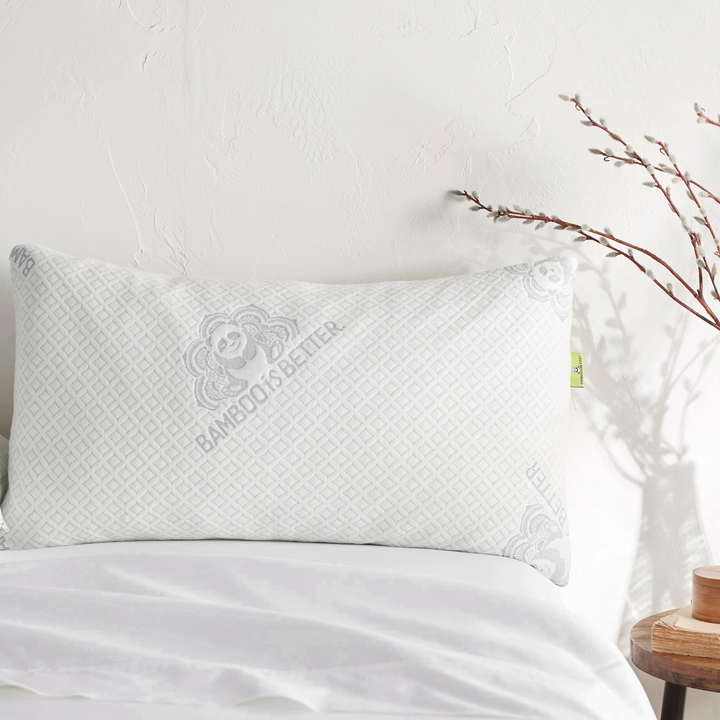 Single bamboo pillow placed on a made bed