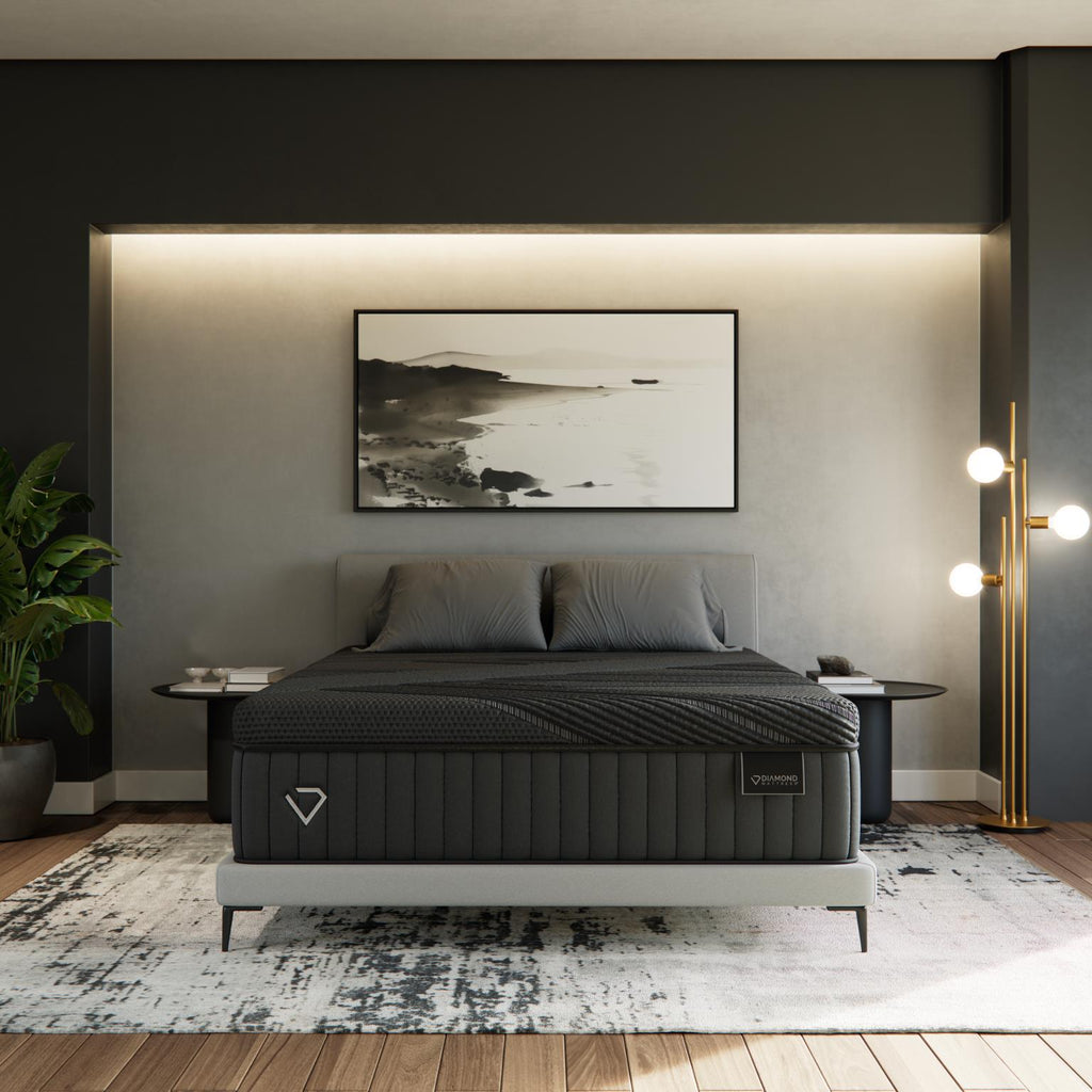 Luxury Black Diamond Hybrid Mattress in a modern bedroom with grey walls, wall art, and soft lighting.