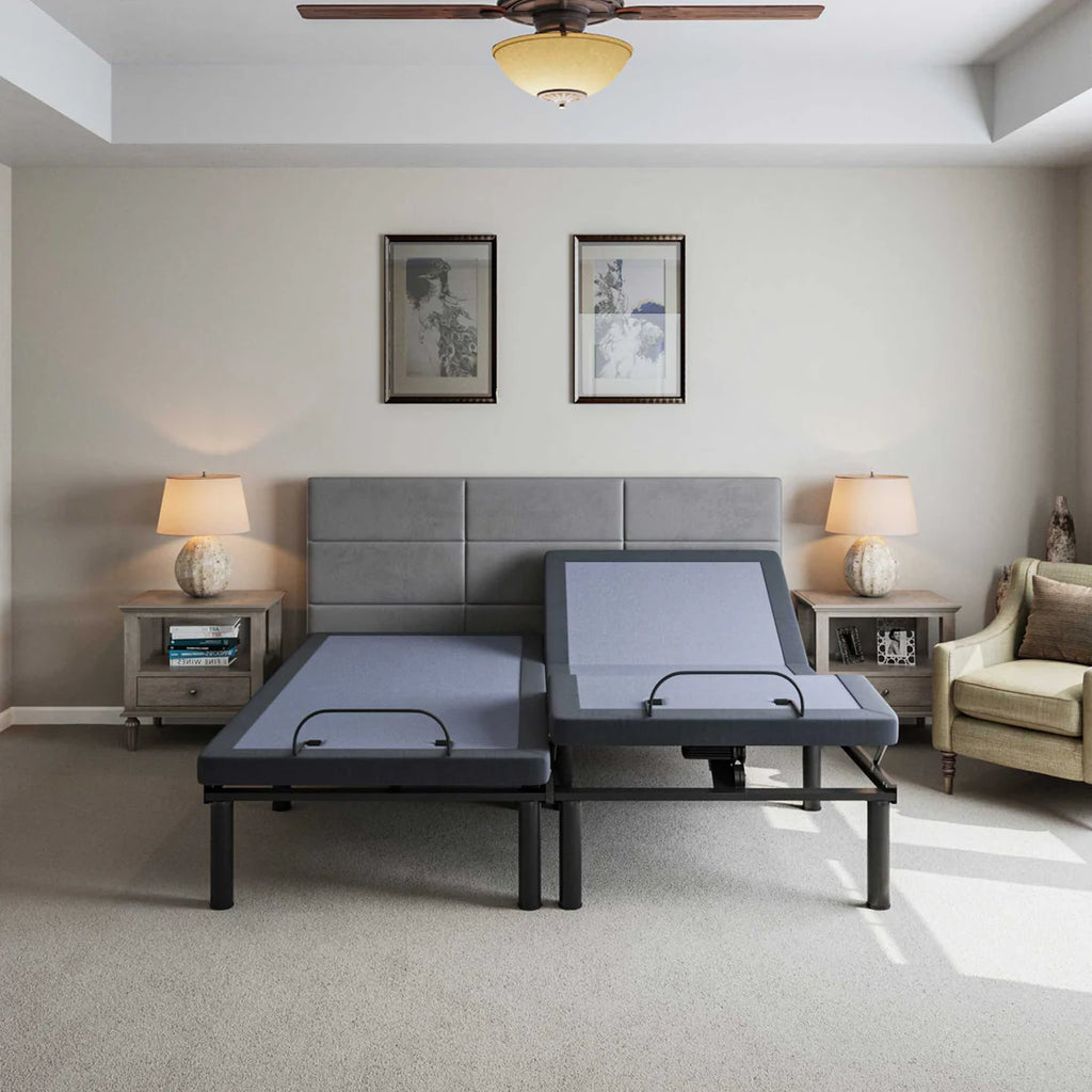 BT2000 adjustable bed base by Bamboo is Better in split king configuration with one side elevated in a modern bedroom with gray headboard and bedside lamps.