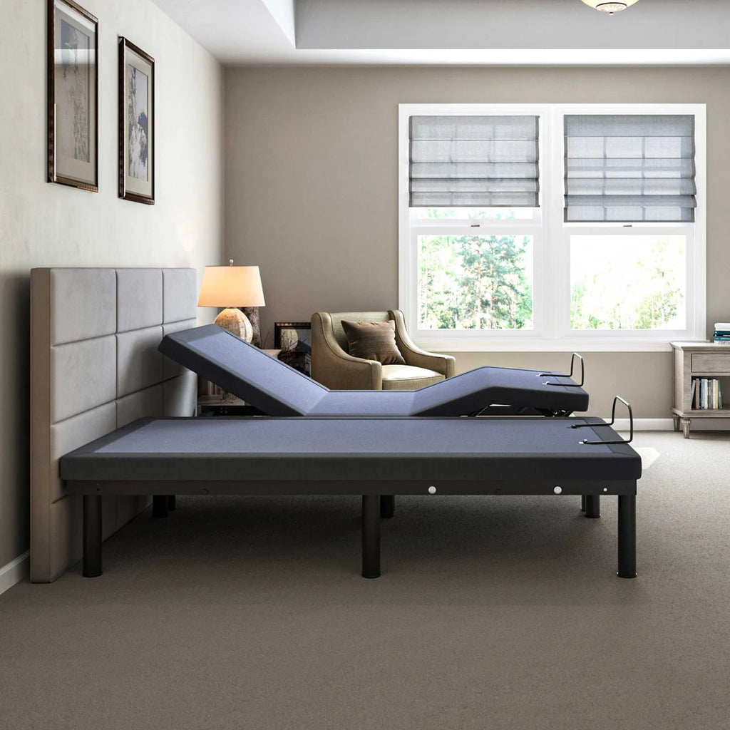 BT2000 split king adjustable bed base by Bamboo is Better shown from the side with one side raised in a modern bedroom with window and accent chair.