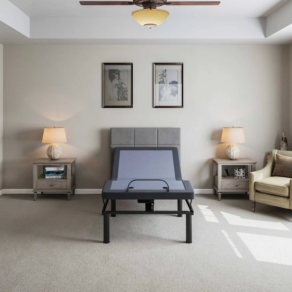 BT2000 Twin XL adjustable bed base by Bamboo is Better shown in a neutral modern bedroom with gray headboard, nightstands, and lamps.