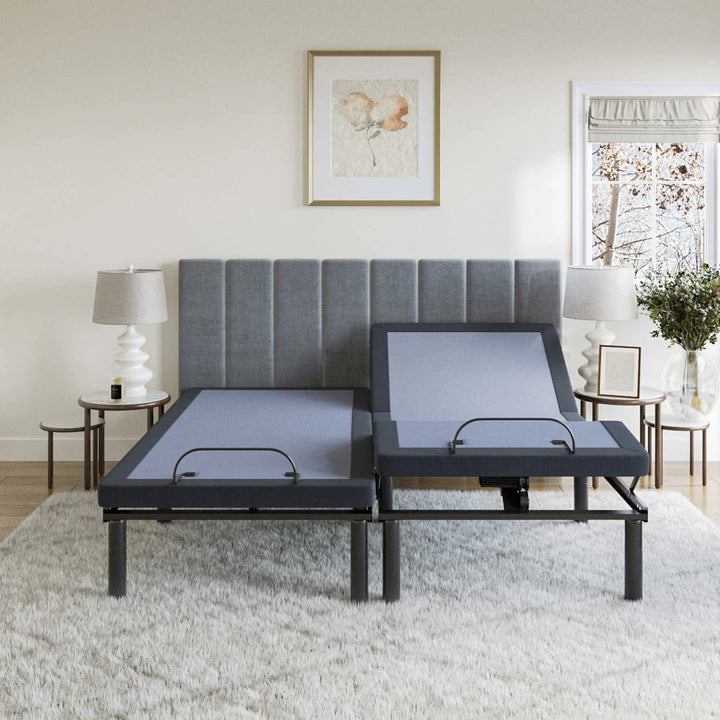 BT2500 adjustable bed base by Bamboo is Better in split king configuration with one side raised in a modern light bedroom with gray headboard and side lamps.