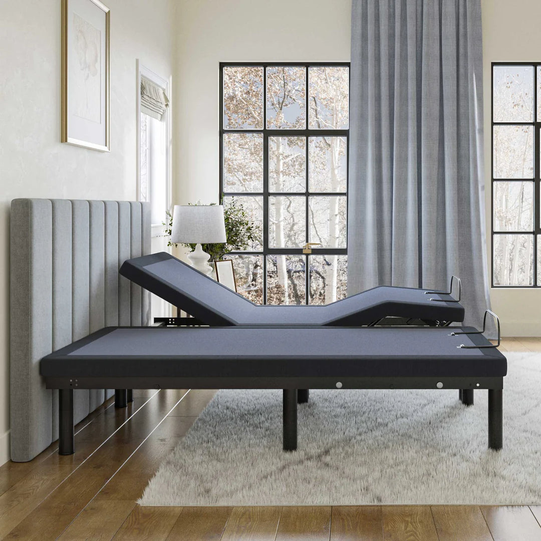 BT2500 adjustable bed base by Bamboo is Better shown in side profile with head and foot elevated near large windows in a modern neutral bedroom.