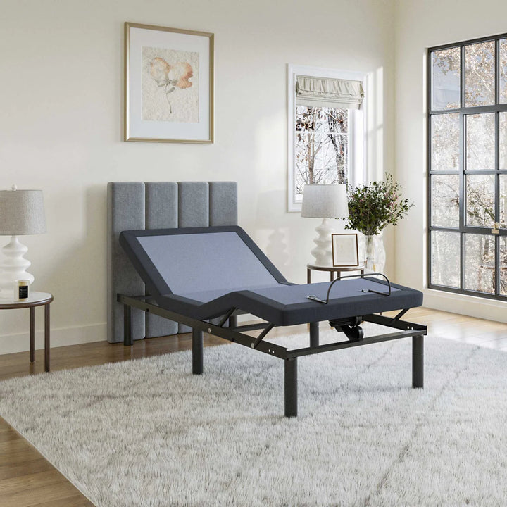 BT2500 Twin XL adjustable bed base by Bamboo is Better with head elevated in a modern light bedroom with gray headboard and natural lighting.
