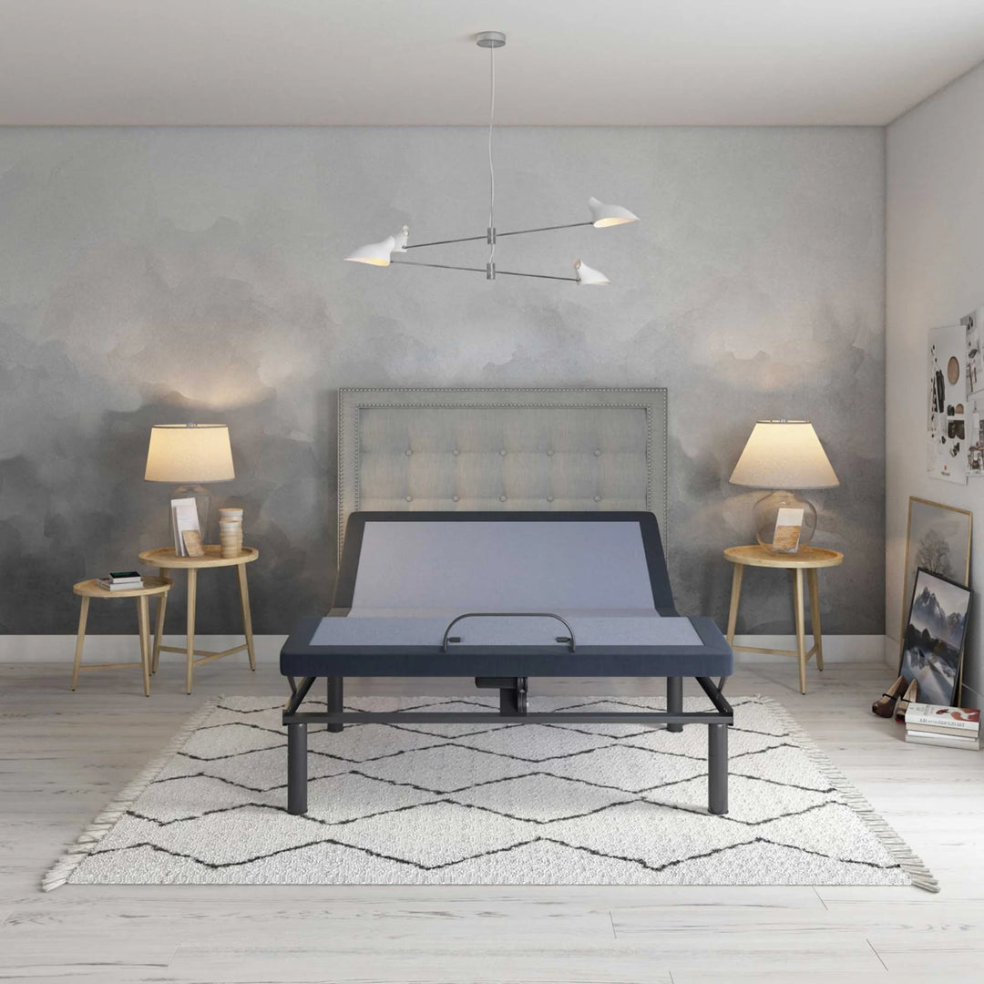 BT3000 adjustable bed base by Bamboo is Better in a gray modern bedroom with tufted headboard, wooden side tables, and soft rug.