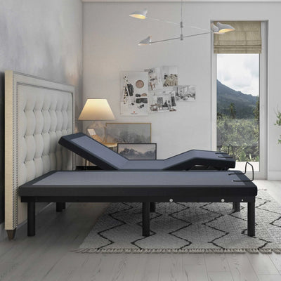BT3000 adjustable bed base by Bamboo is Better with head elevated beside a large window in a gray modern bedroom with mountain view.