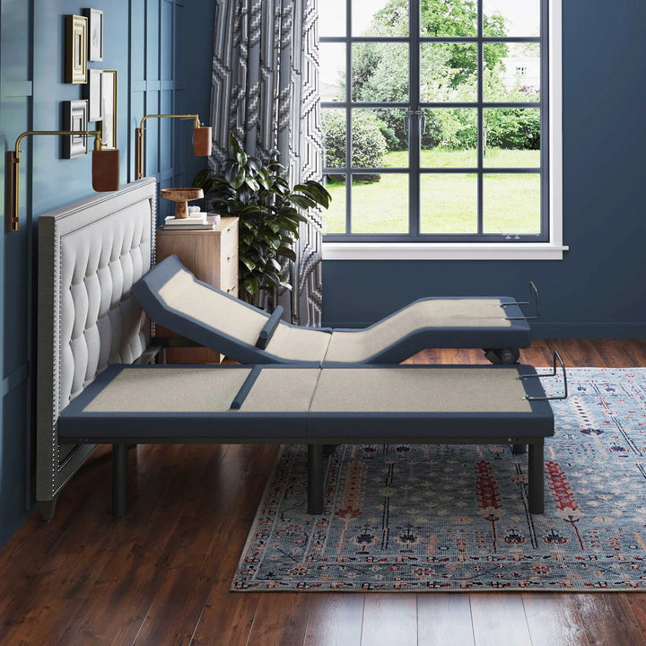 BT6500 adjustable bed base by Bamboo is Better shown in side profile with head and foot elevated in a modern blue bedroom with large window.