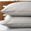 Two feather gray bamboo pillowcases stacked on white bedding, highlighting cooling, antibacterial fabric with a soft matte finish.