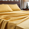 Close-up view of soft mustard bamboo fabric showcasing the smooth weave and natural sheen of the material.