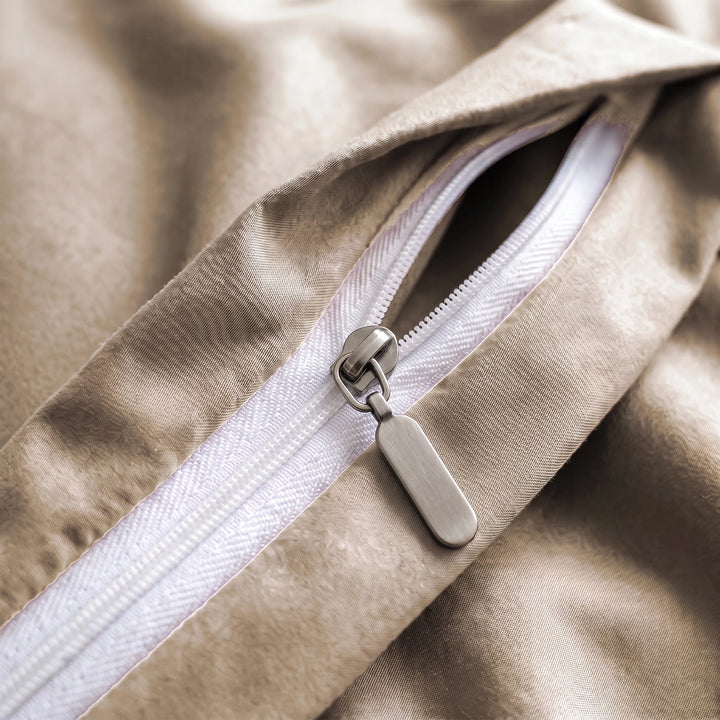 Summer Sand duvet zipper close-up with matte pewter slider and dangling paddle pull