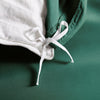 emerald green bamboo duvet cover from the Signature Collection, close-up of internal corner tie securing emerald green insert with smooth sateen fabric
