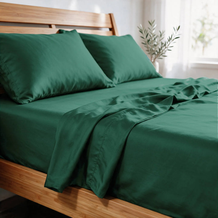 emerald green bamboo viscose sateen pillowcases close-up in morning light, showing the soft low-sheen finish