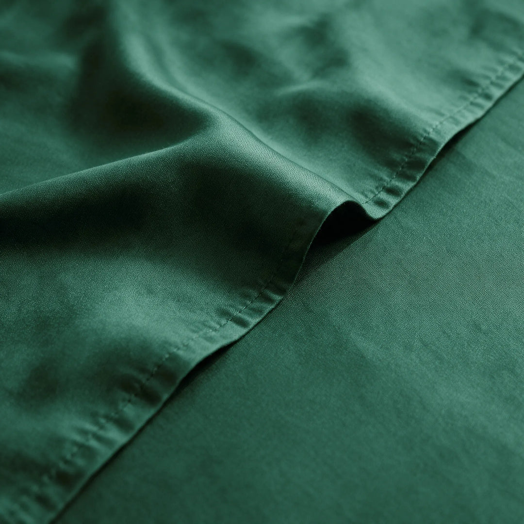 emerald green bamboo viscose sateen weave close-up with hem stitching