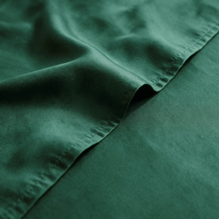 emerald green bamboo viscose sateen weave close-up with hem stitching