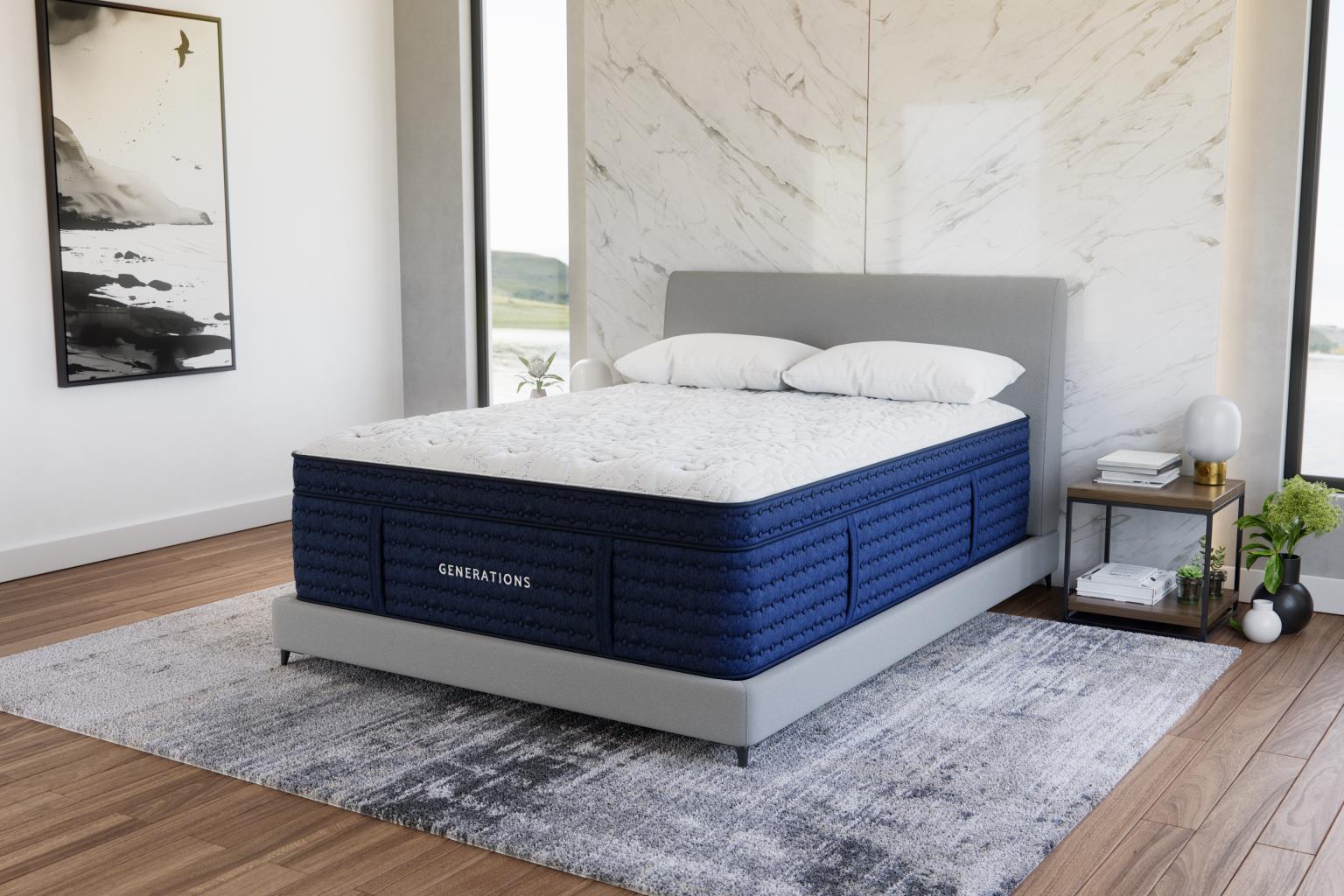 Angled view of the Generations 2.0 Luxe Hand-Tufted Latex Hybrid Mattress in a modern bedroom with marble accent wall and light wood floors