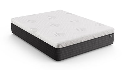 Angled side view of the Gilded Mattress showing its white quilted top and dark gray base on a white background.